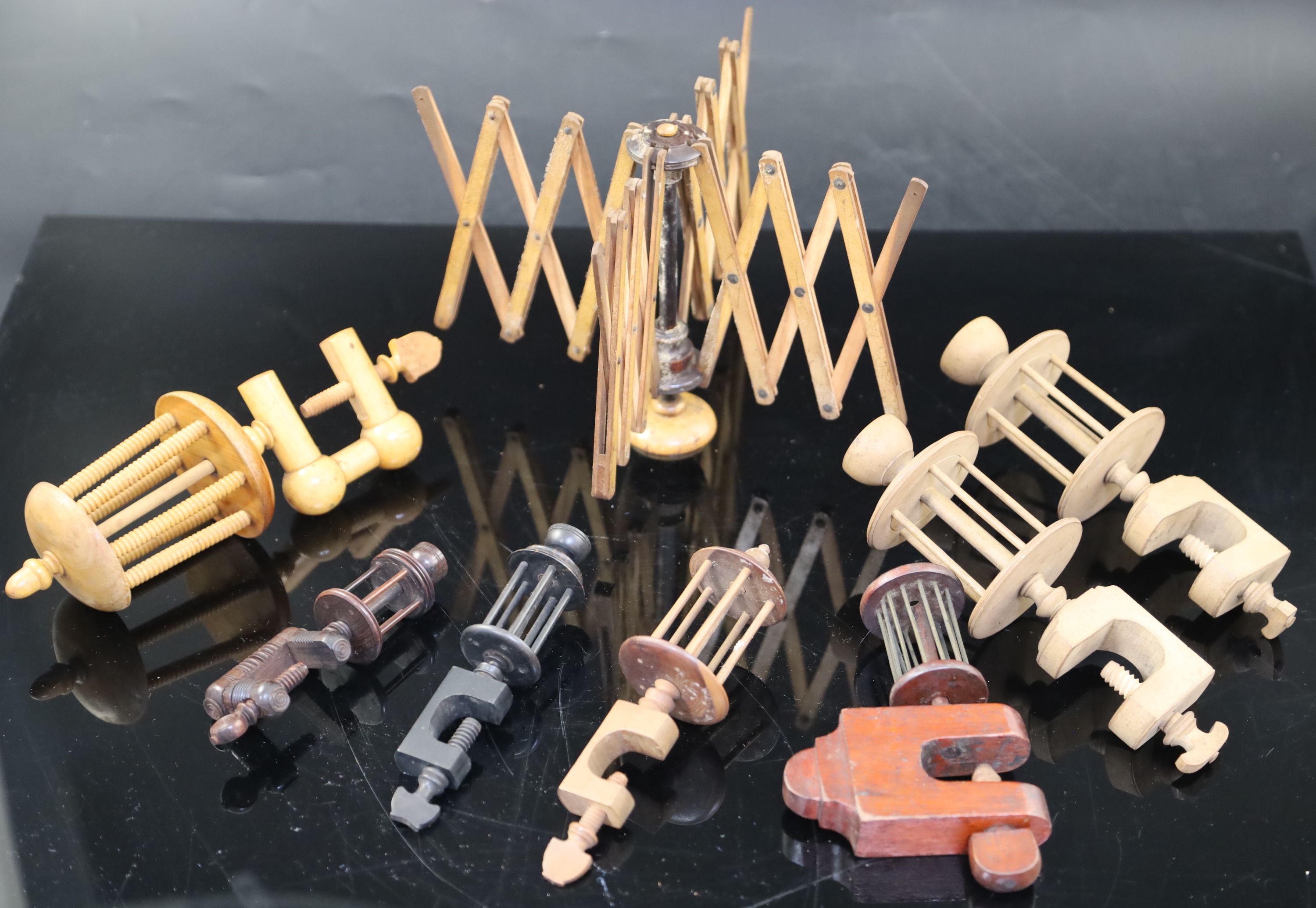A collection of assorted treen silk winding winders